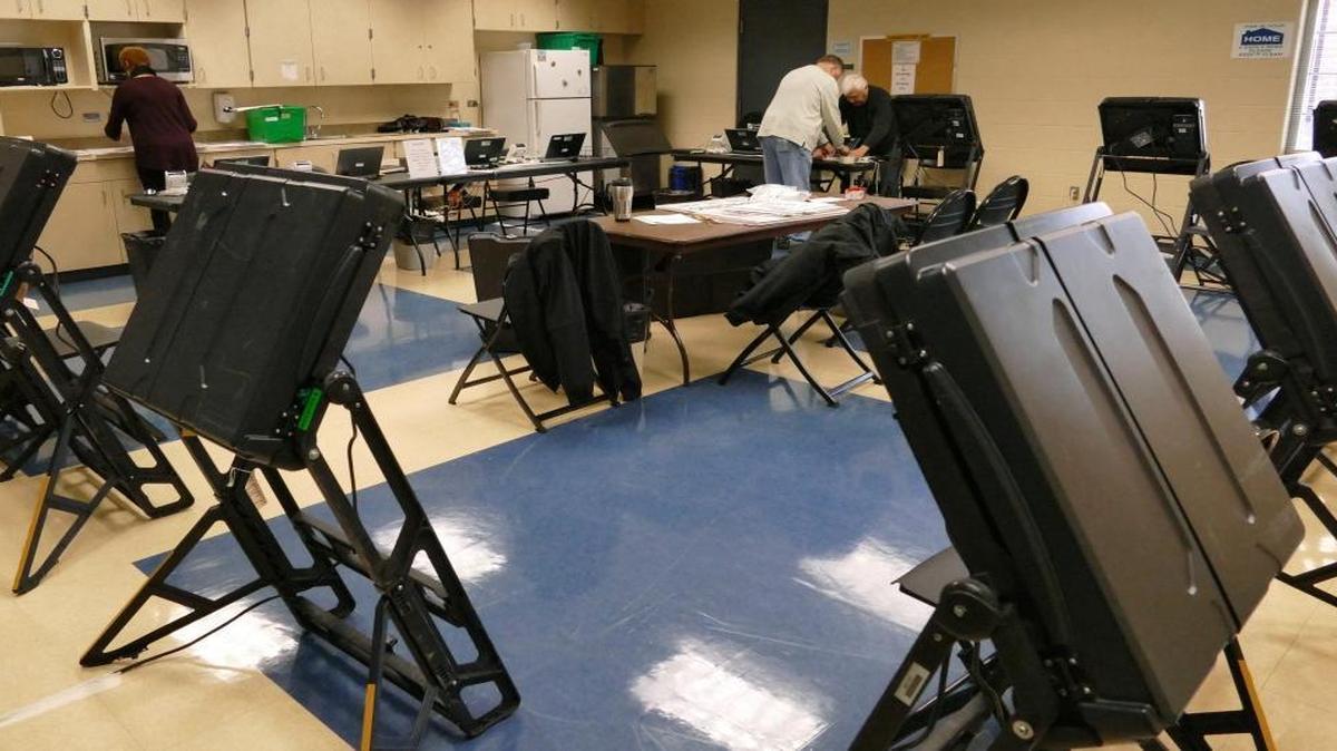 Precinct workers prepare for early voting at the CPCC Facilities Services building in the March primary.