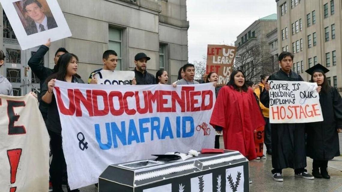Immigration activists chant on the front steps of the Attorney General's office at in 2014. Legislation approved in the General Assembly in 2015 would ban local governments from refusing to enforce immigration laws.