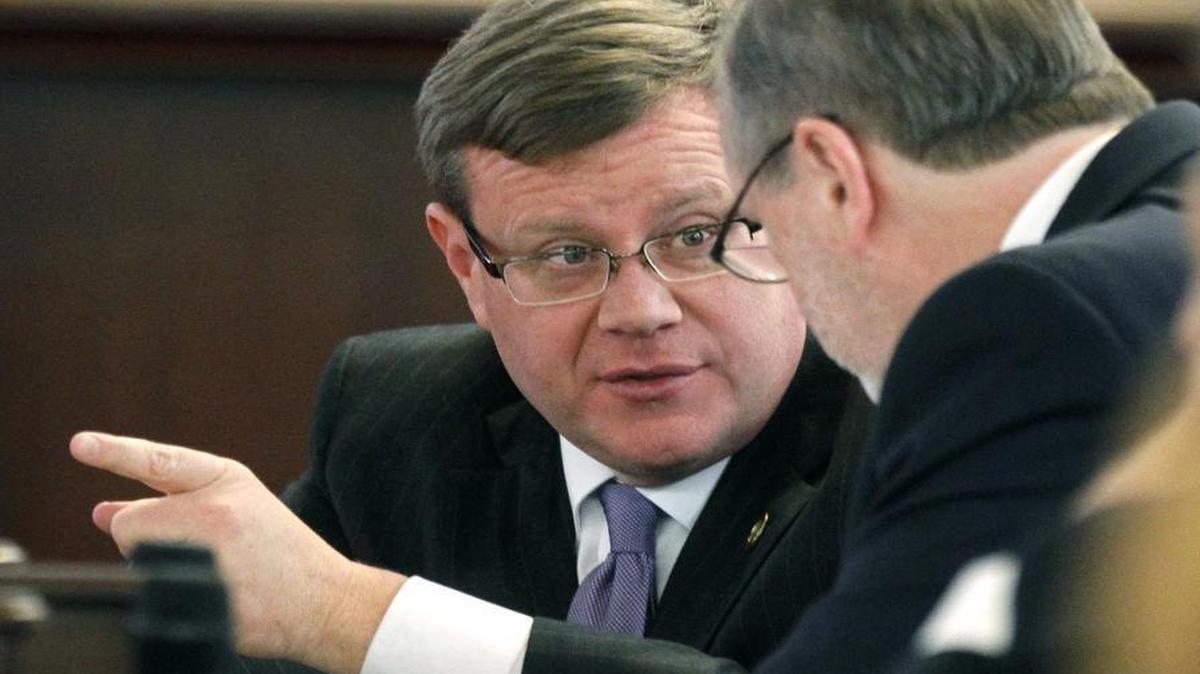 House Speaker Tim Moore, left, and Senate leader Phil Berger chat during a special session of the North Carolina General Assembly in Raleigh on Dec. 16.