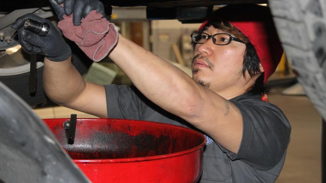 Mechanic Deven Lee works on a car at Leith Volkswagen in Cary. Labor charges for car repairs now include sales tax.