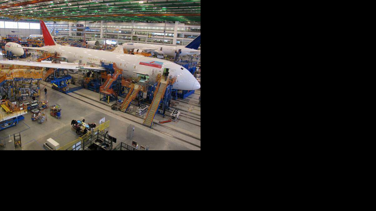 
Workers assemble Boeing 787 Dreamliners in the company's massive assembly plant in North Charleston, S.C., on Thursday, Dec. 19, 2013. After Boeing chose not to locate a new jet factory in North Carolina, public records showed the frantic behind-the-scenes recruiting effort by McCrory’s administration, including a meeting between the governor and Boeing officials, possible sites for the factory and the state’s $683 million incentives offer. 
