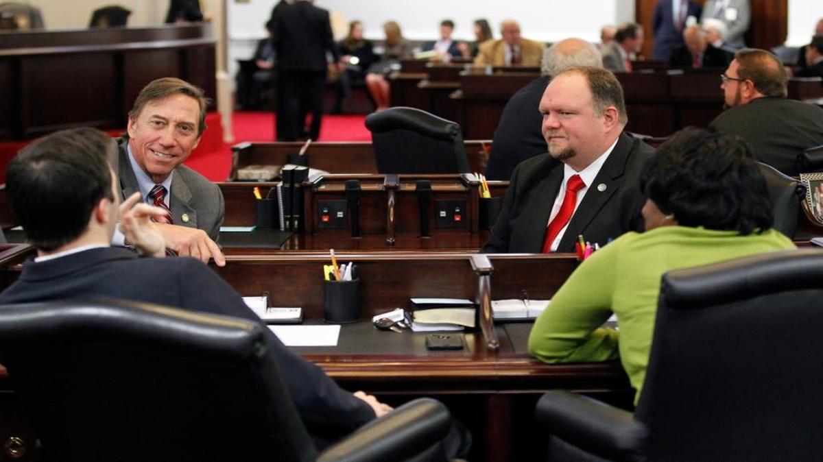 Republican Sens. Rick Gunn, back left, and Ralph Hise , back right, confer with Democratic Sens. Jeff Jackson, front left, and Valerie Foushee, front right, as the N.C. General Assembly reconvenes for a special session on Dec. 13, 2016. Hise is pushing for a budget provision that changes food stamp eligibility requirements.