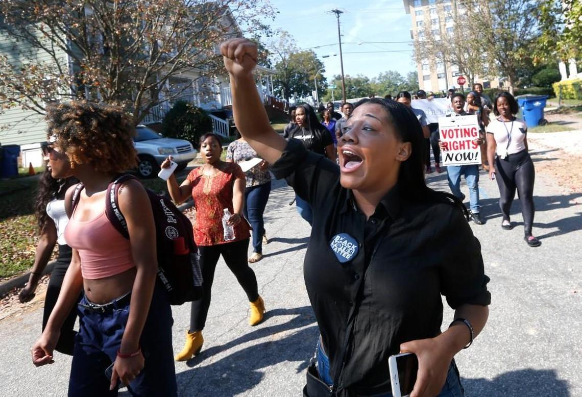 Shaw junior Essence Shelton and about 50 students from Shaw University marched to Chavis Community Center in Raleigh, N.C. during the first day of early voting Thursday, Oct. 20, 2016.