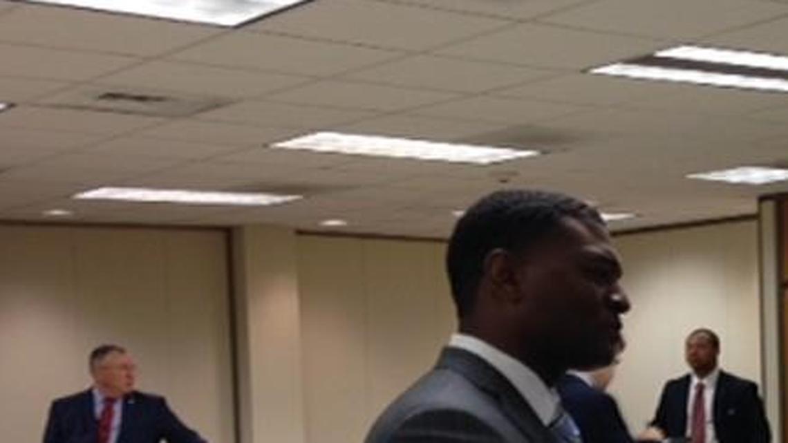 Department of Environmental Quality Secretary Michael Regan (left) is congratulated by Sen. Tom McInnis after Thursday confirmation hearing in Raleigh.