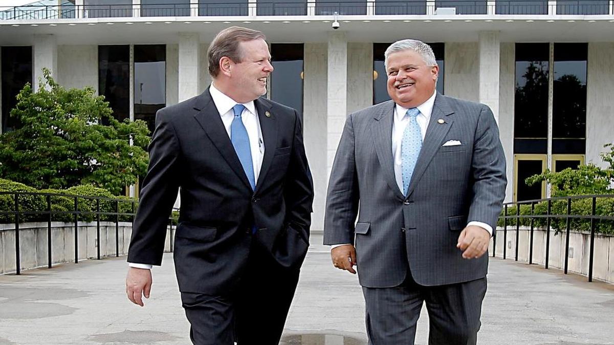 Republican Senators Phil Berger, President Pro Tempore, left, and Tom Apodaca, right, head to an afternoon session of the Senate Conference Committee on S.B. 744, Appropriations Act of 2014 Committee at the N.C. General Assembly's Legislative Office Building on Tuesday, July 15, 2014 in Raleigh, N.C.