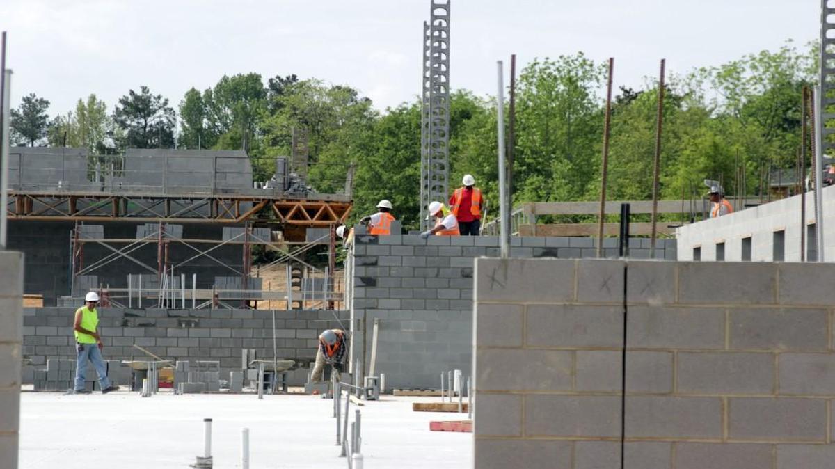 Construction workers laid the foundation for the new Bryan Road Elementary School in April 2016.