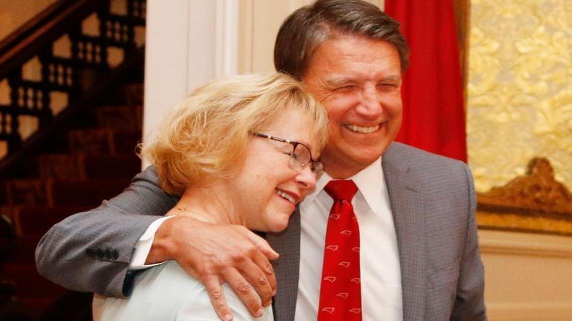 From left, Aldona Wos hugs Pat McCrory during press conference where she announced her resignation.