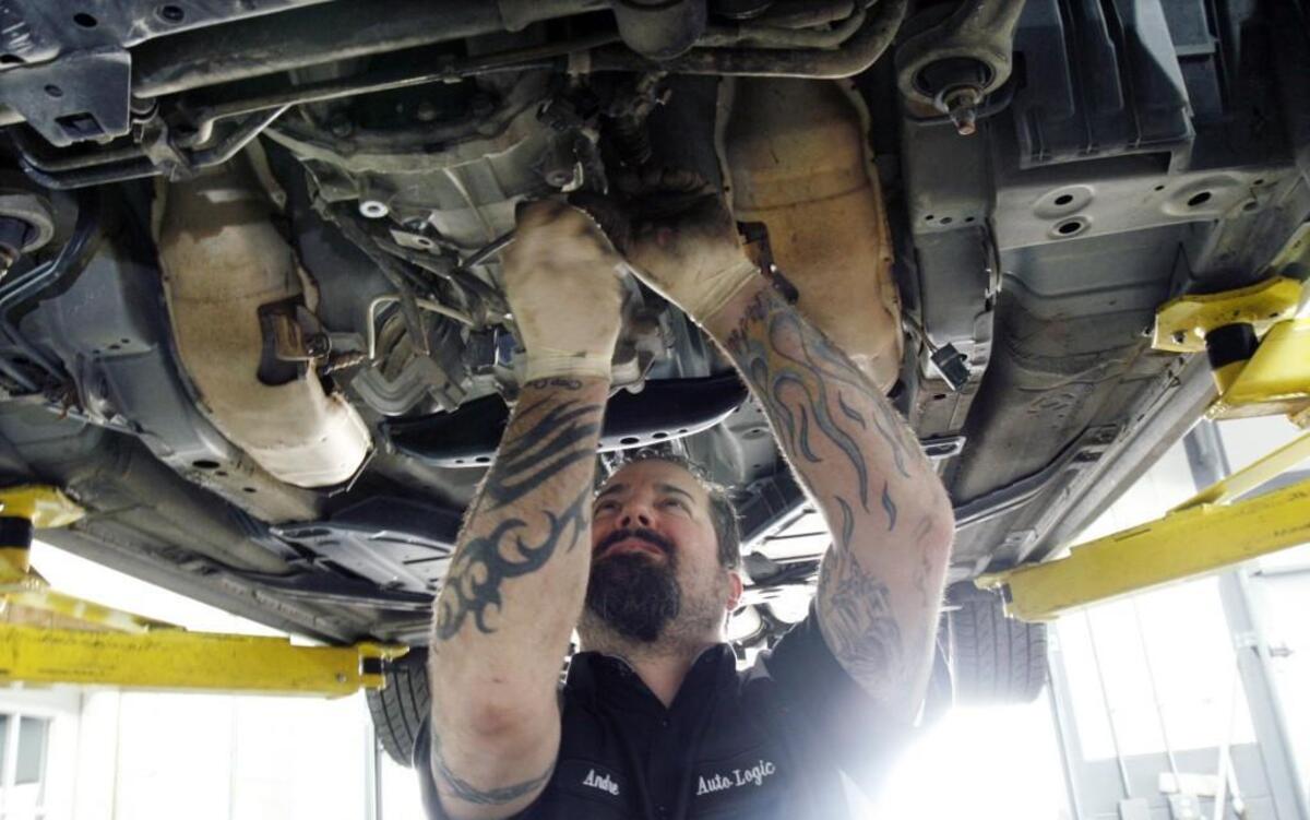 Tech mechanic Andre Dalrymple does transmission inspection and repairs to a customer's car at Auto Logic of Carrboro in 2013. Car repairs will be subject to sales taxes starting on Tuesday.