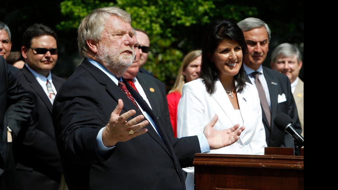 
Commerce Secretary Bobby Hitt is joined by Gov. Nikki Haley and state officials outside the Governor's Mansion Complex as they make it official by announcing Volvo will build a $500 million factory in Berkeley County to produce 100,000 cars a year. 
