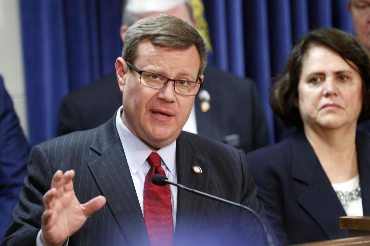 Speaker of the House Rep. Tim Moore, left, speaks at a press conference on March 30, 2017. House Speaker pro tem Rep. Sarah Stevens listens at right.