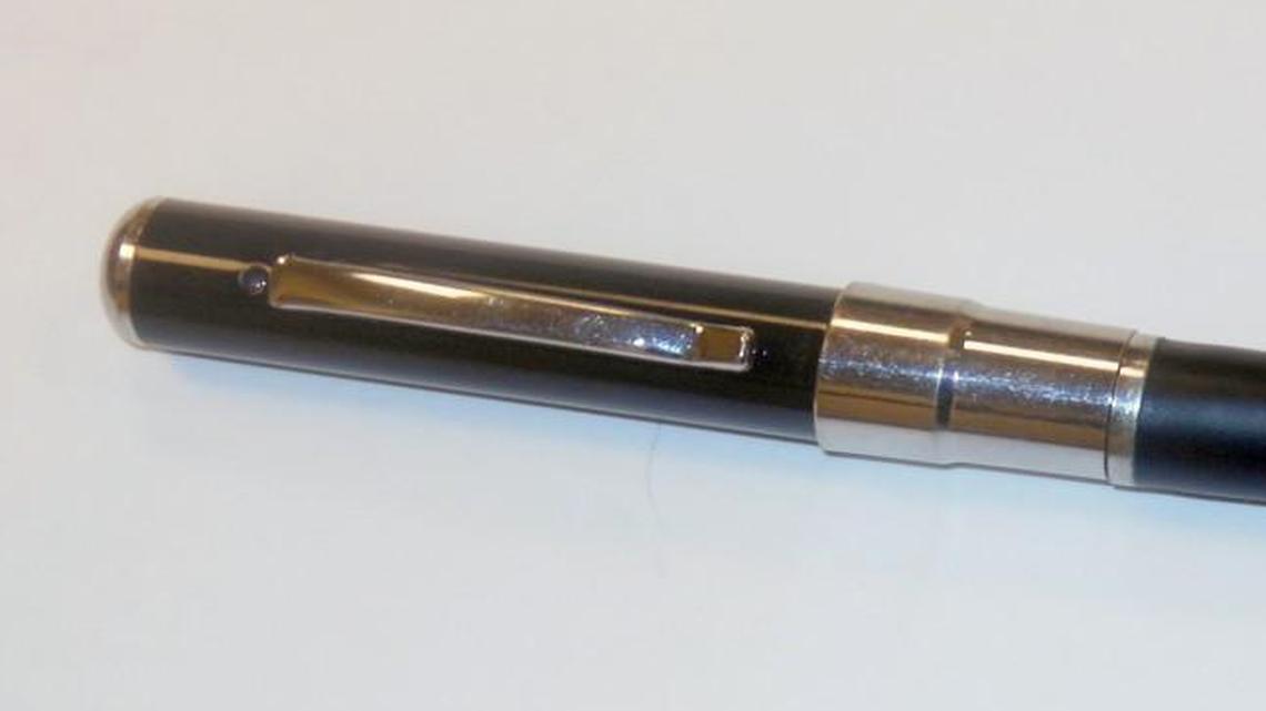 The spy pen. The camera lens is just above the pocket clip at left.