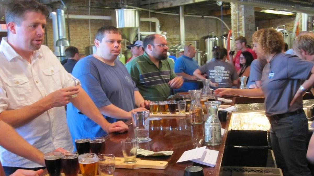 In this file photo, customers line up for tastings at White Street Brewing Company in Wake Forest.