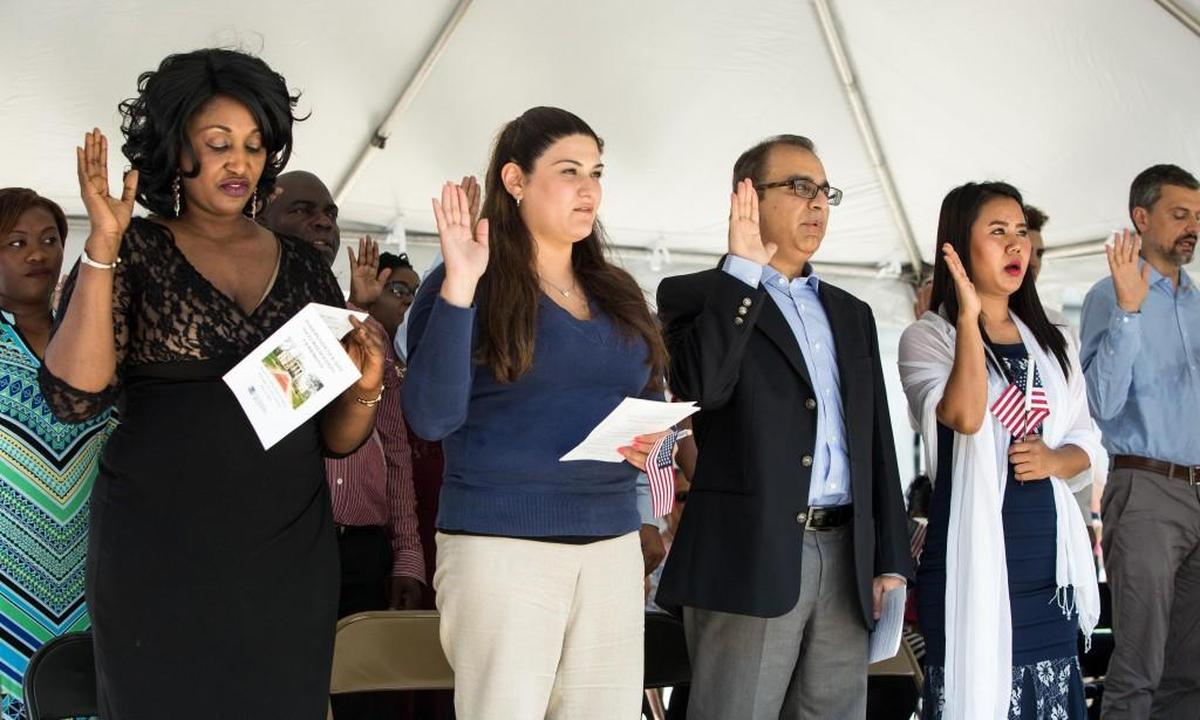 New United States citizens are sworn in during a naturalization ceremony at the NC State Capitol Building in Raleigh on Tuesday, July 4, 2017.