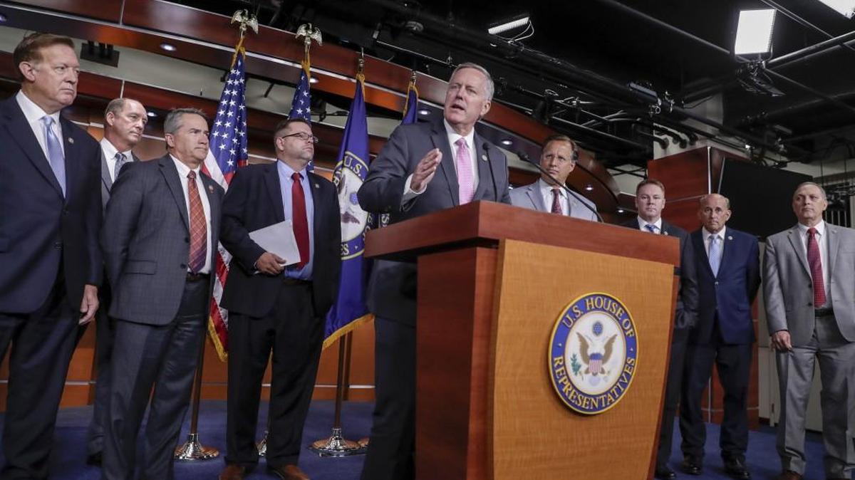 House Freedom Caucus Chairman Rep. Mark Meadows, R-N.C., center, speaks during a news conference on Capitol Hill in Washington, Wednesday, July 12, 2017, to say that his group wants to delay the traditional August recess until work is accomplished on health care, the debt ceiling and tax reform. (AP Photo/J. Scott Applewhite)