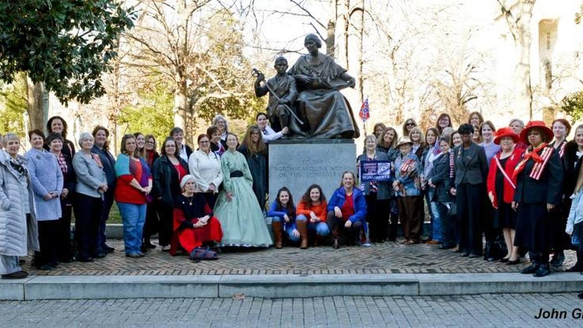 Women and children of the United Daughters of the Confederacy and the Order of Confederate Rose gathered at the Women of the Confederacy monument on Jan. 20, 2018. A photo of the group was to be sent to Gov. Roy Cooper, who wants to move the monument off the Capitol grounds.