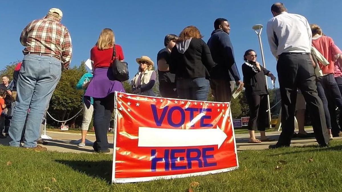 Voters wait in line for early voting at the Lake Lynn Community Center in Raleigh, N.C. Wednesday, October 26, 2016.