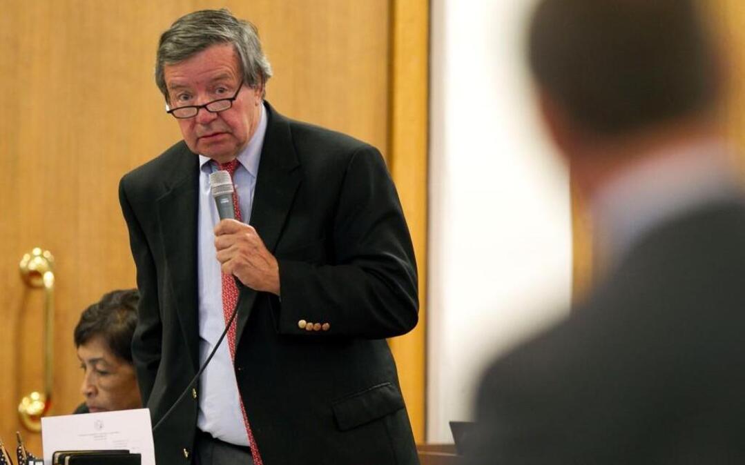Rep. Paul Luebke (left) of Durham, N.C. and Rep. Mike Hager of Burke County debate SB 729, legislation dealing with coal ash reform during the House session on Wednesday, August 20, 2014 in Raleigh, N.C. Luebke died Saturday night at age 70.
