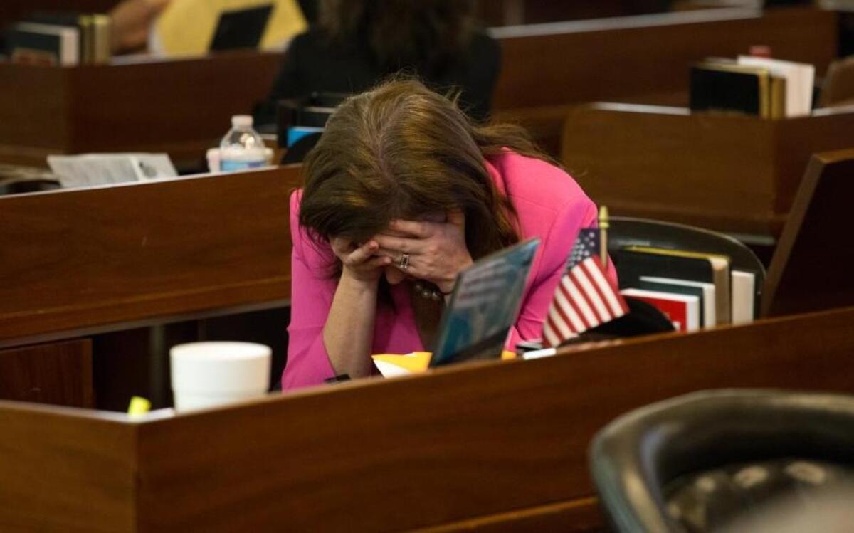 
Rep. Tricia Cotham, D-Mecklenburg, takes a moment during a pause in action on the House floor at 12:45 a.m. on Wednesday, Sept. 30, 2015. The House began its work day – the final one of the 2015 session – at 11 a.m. on Tuesday.
