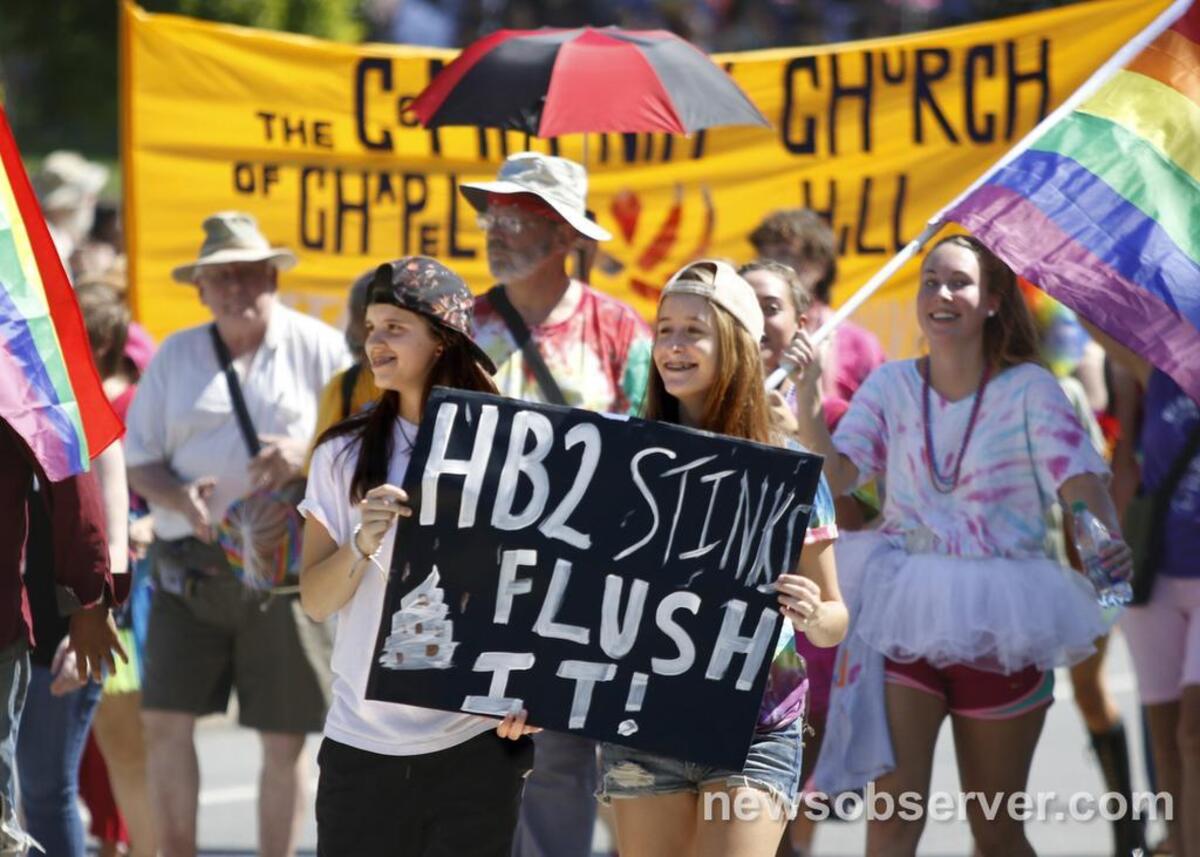 Opposition to the Republican-led NC Legislature's HB2 bill was evident as number signs were carried among the marchers at the 32nd annual NC Pride 2016 parade in Durham, NC which kicked off down West Main Street at 1pm Saturday, September 24, 2016 with thousands marching around the streets surrounding the Duke East Campus.