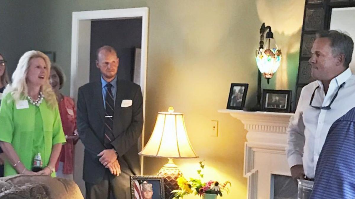 North Carolina Lt. Gov. Dan Forest, right in white shirt, attends a fundraiser in Forest City on July 13, 2017. Also at the event was Robin Webster, left, blonde hair, who is a minister at Word of Faith Fellowship in Spindale, NC. Dozens of former members of Word of Faith Fellowship have accused the church of beating congregants.