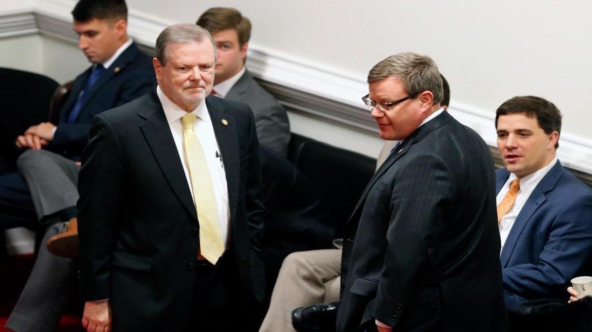N.C. Senate leader Phil Berger, left, and Speaker of the House Tim Moore confer on the Senate floor at the Legislative Building in Raleigh, NC on Dec. 21, 2016.
