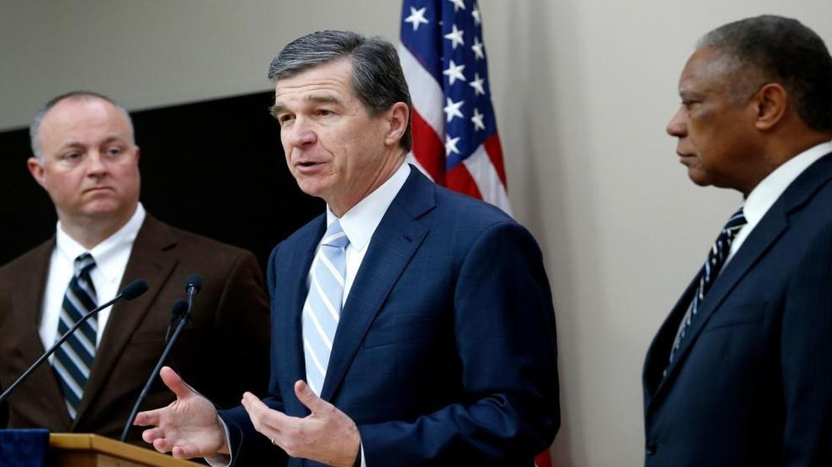 N.C. Gov. Roy Cooper, center, holds a press conference with N.C. House Democratic leader Darren Jackson, left, and N.C. Senate Democratic leader Dan Blue on Feb. 14, 2017.