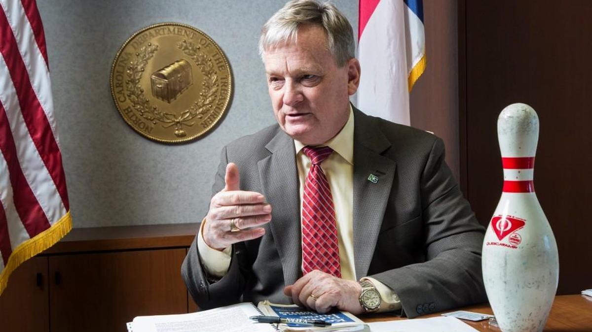North Carolina Treasurer Dale Folwell is interviewed in his office in January 2017. As a candidate for treasurer Folwell used a bowling pin as a prop to make a point: “In bowling you have 10 pins, but only one ball. Focus to hit the one pin you need to hit. That is the only way to make the rest of them fall.”