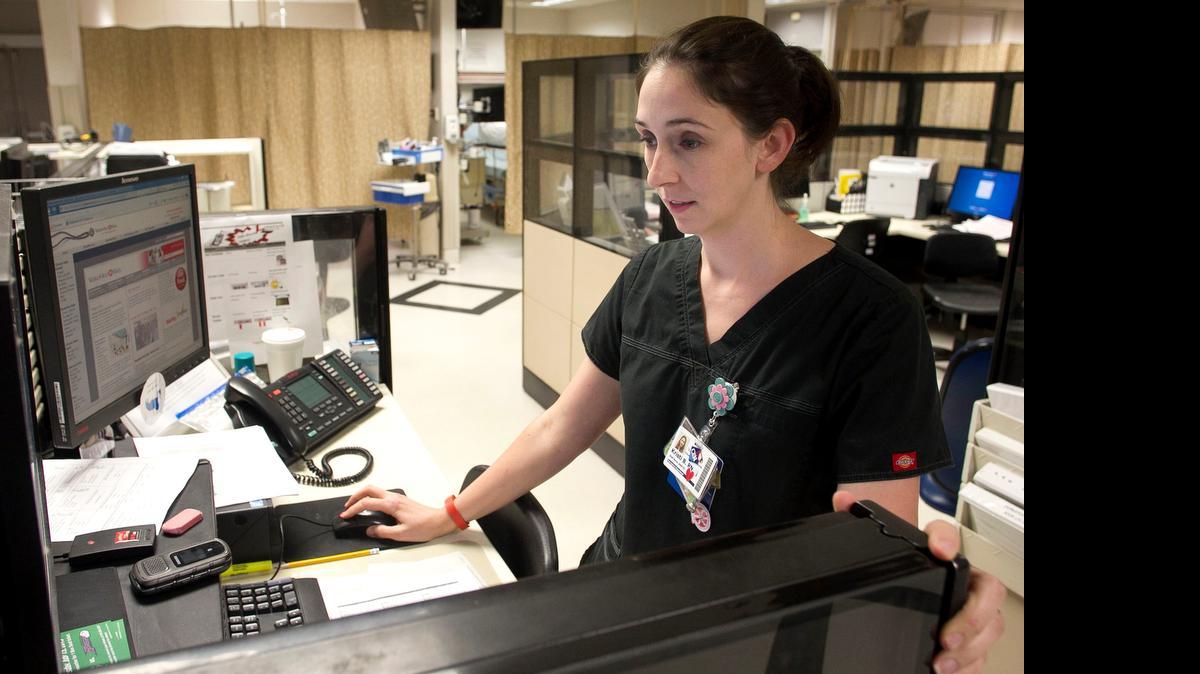 
Wake-Med Emergency Room Charge Nurse Kristi Blankenship works in one of four emergency room suites at the WakeMed Raleigh campus on New Bern Avenue in Raleigh, N.C. on Wednesday July 15, 2015.
