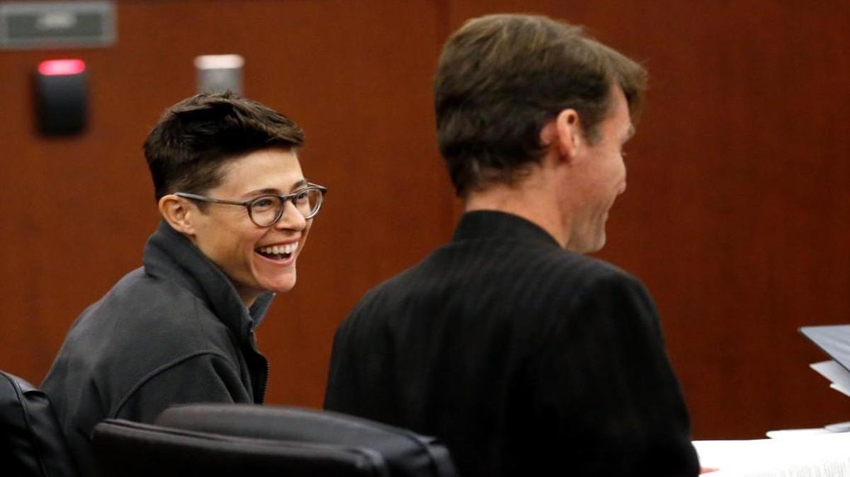 Gigi Burkhalter, left, laughs with her attorney Scott Holmes during her trial in a Wake County courtroom in Raleigh, NC on Nov. 2, 2016. She was arrested on littering charges for leaving a toilet in front of the Governor's Mansion to protest HB2. Her case was dismissed Monday, Dec. 5, 2016.