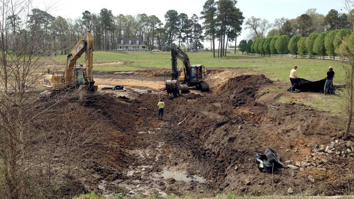 
Workers with Land Mechanics, a contractor for Restoration Systems, use excavators to change the elevation of a recently restored stream channel March-April 2013. The site is located near Newton Grove in the Neuse River Basin.
