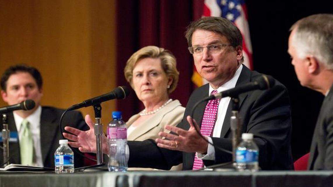 
Gov. Pat McCrory, second from right, speaks at a panel discussion with state municipal leaders at an event put on Wednesday by the N.C. League of Municipalities at the N.C. Museum of History in Raleigh.  Listening to his comments are, from left, Paul Meyer, executive director of the N.C. League of Municipalities; Susan Kluttz, N.C. Secretary of the Department of Cultural Resources; and Tony Tata, Secretary of the N.C. Department of Transportation. 
