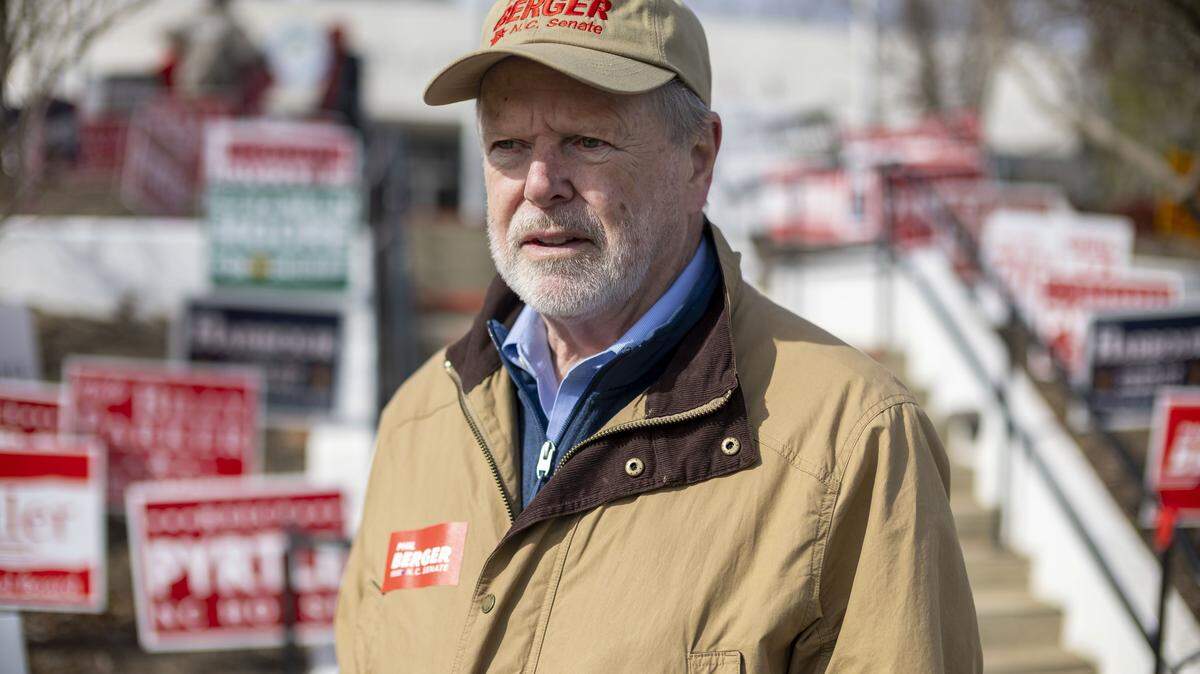 N.C. Sen. Phil Berger waits to greet voters outside the polling place at the city hall on Tuesday, Feb. 24, 2026 in Eden, N.C.