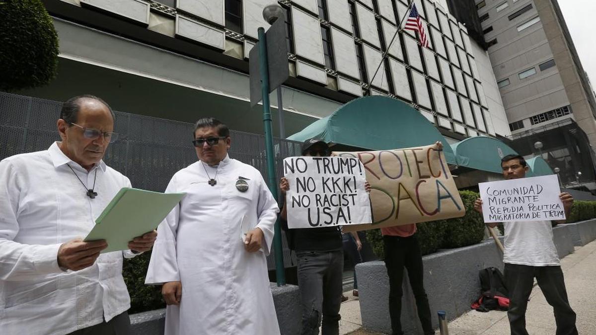 Migrant Rights Activist Father Alejandro Solalinde, left, reads a document during a protest in support of the Deferred Action for Childhood Arrivals, DACA, outside of the U.S. embassy in Mexico City, Wednesday, Sept. 6, 2017. Many religious leaders oppose Trump’s plan to dismantle DACA, a program that protects from deportation those who were brought into the U.S. illegally as young children.