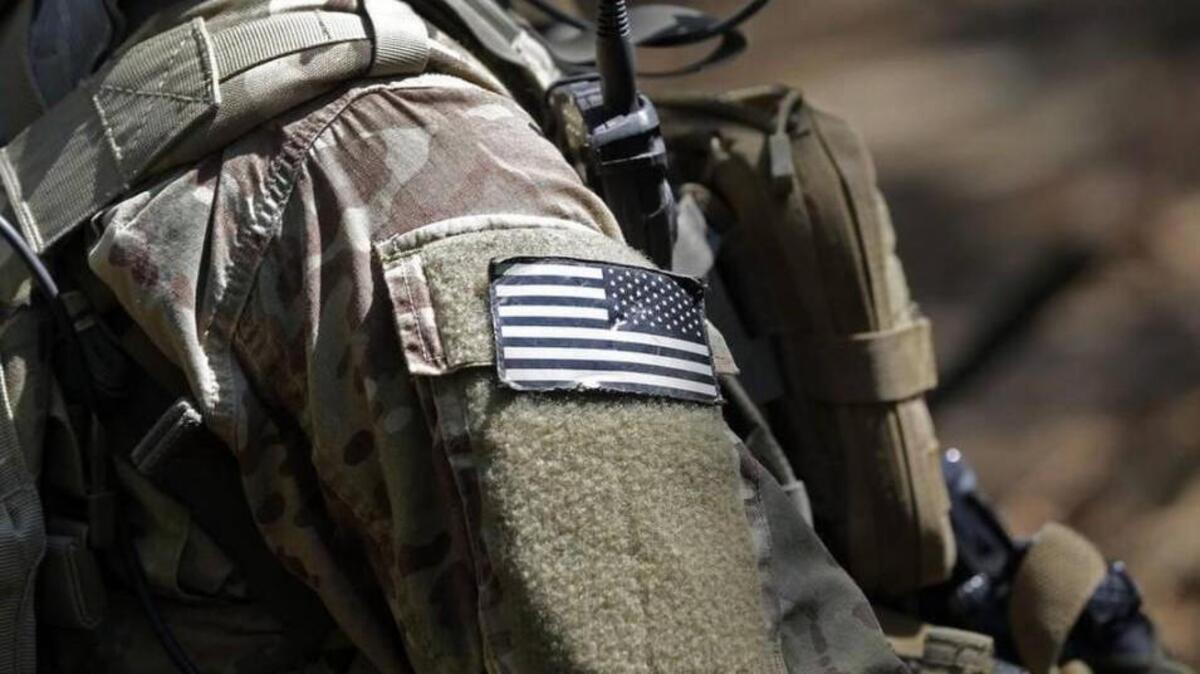 A United States flag patch adorns the uniform of a paratrooper during a training exercise at Fort Bragg earlier this year.