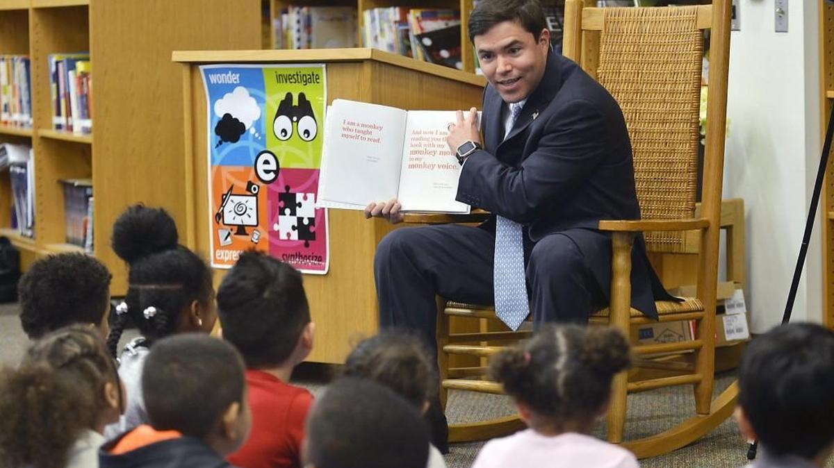 N.C. schools Superintendent Mark Johnson reads a book to kindergarteners during his visit at East Garner Elementary School in Garner, N.C. Monday, April 3, 2017.