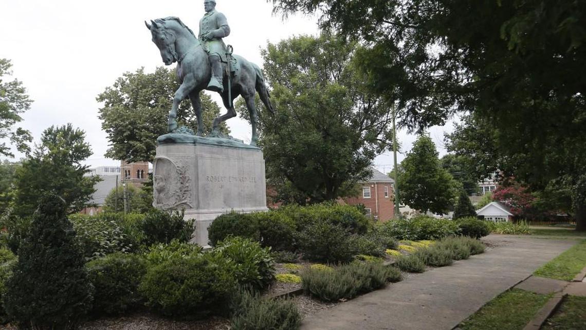 The statue of Confederate General Robert E. Lee still stands in Lee park in Charlottesville, Va., Monday, Aug. 14, 2017. The removal of the statue is in litigation and is at the center of the racial tensions and demonstrations in the town.
