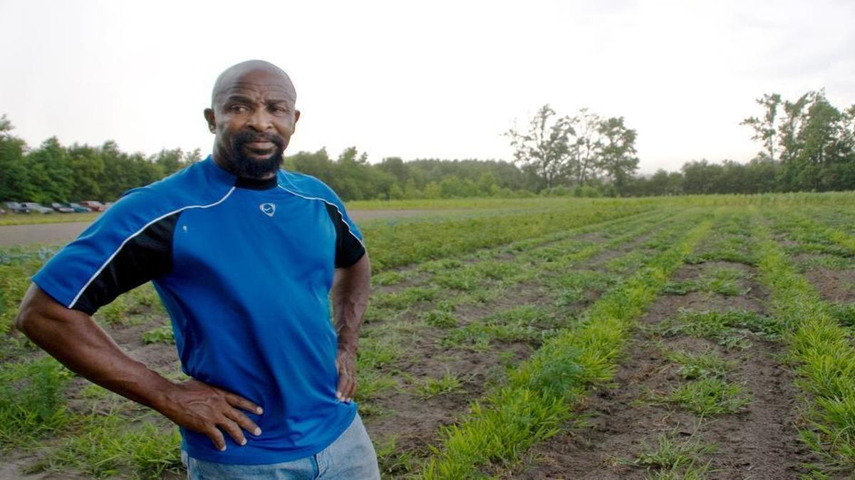 
Rev. Richard Joyner, pastor of Conetoe Chapel Missionary Baptist Church in one of the gardens he helped start to help congregants develop healthier eating habits.
