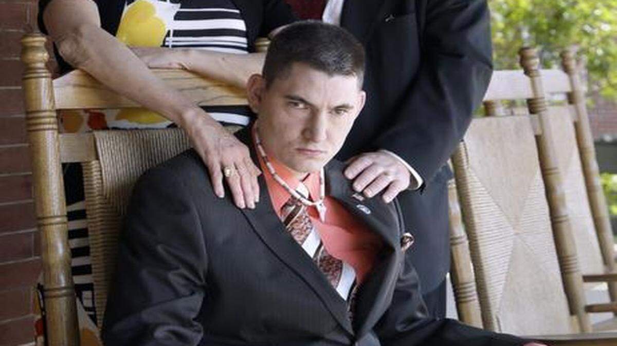 
Burt Powell was sexually molested by a staff member while he was in a group home in Conover. Allegedly, other workers knew about this problem but didn’t report it. He is seen with his mother, Laurie Powell, and father, Tom Powell, in Raleigh on April 2, 2015. 
