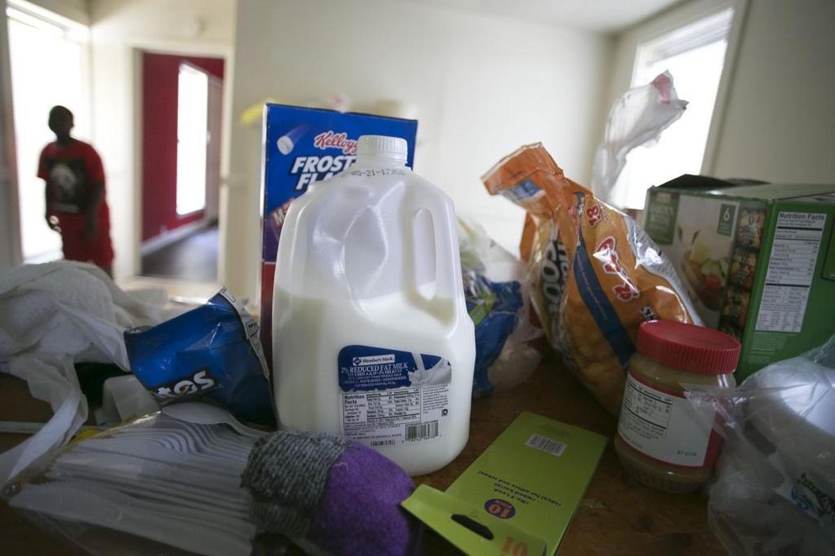 A gallon of milk spoils on the kitchen counter in Patrice Johnson’s new rental home on Thursday in Lumberton. Johnson acquired the rental home this week, and was surprised to discover there was no refrigerator or stove in the home when she moved in.