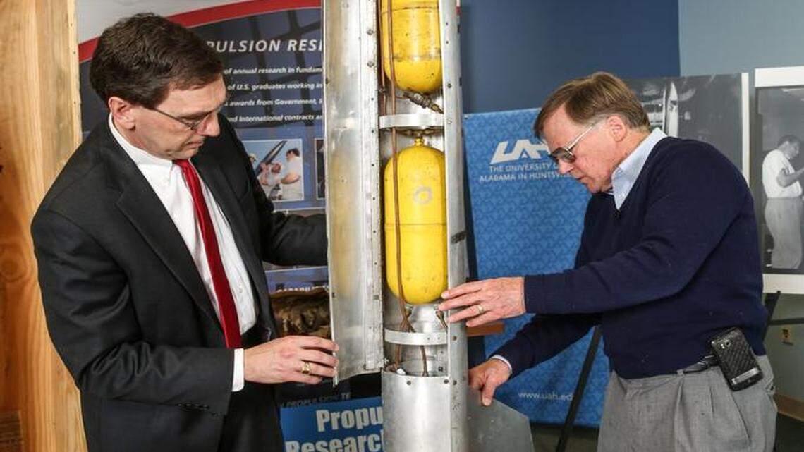 
James Blackmon, principal research engineer for the University of Alabama at Huntsville Propulsion Research Center, right, opens a crate sealed in 1957 that contains a rocket he created as a teen. Robert Frederick, left, director of the Propulsion Research Center was present at the March 19 unveiling.
