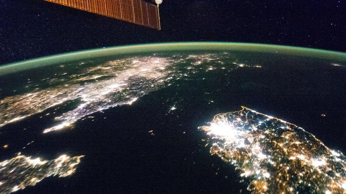 North Korea, the dark area, is sandwiched between China, left, and South Korea in this photograph from the International Space Station.
