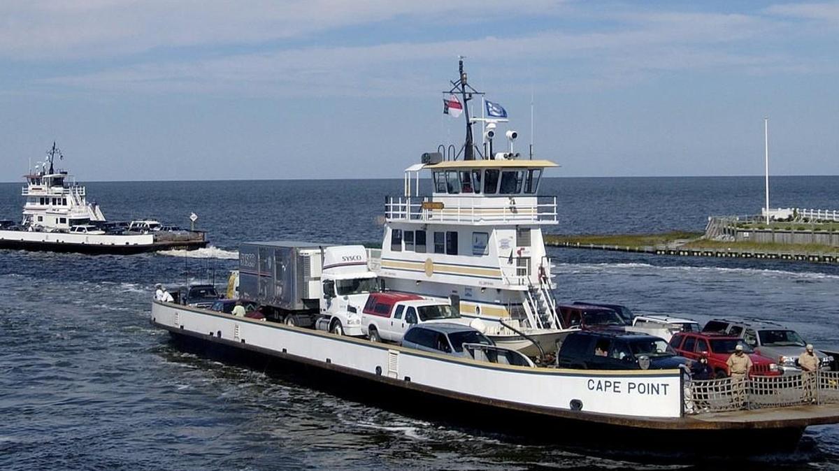 The Cape Point and Ocracoke ferries pass each other at the Hatteras Island ferry port. People planning to take ferries to Ocracoke and other places along the NC coast can now get alerts about delays or cancellations.