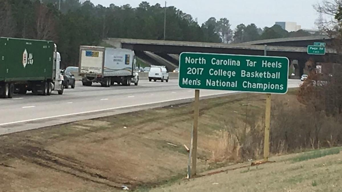 This sign, along westbound Interstate 40 at the Durham County line, is one of two that went up along I-40 recently. The other is three miles from PNC Arena, home of the N.C. State University Wolfpack.