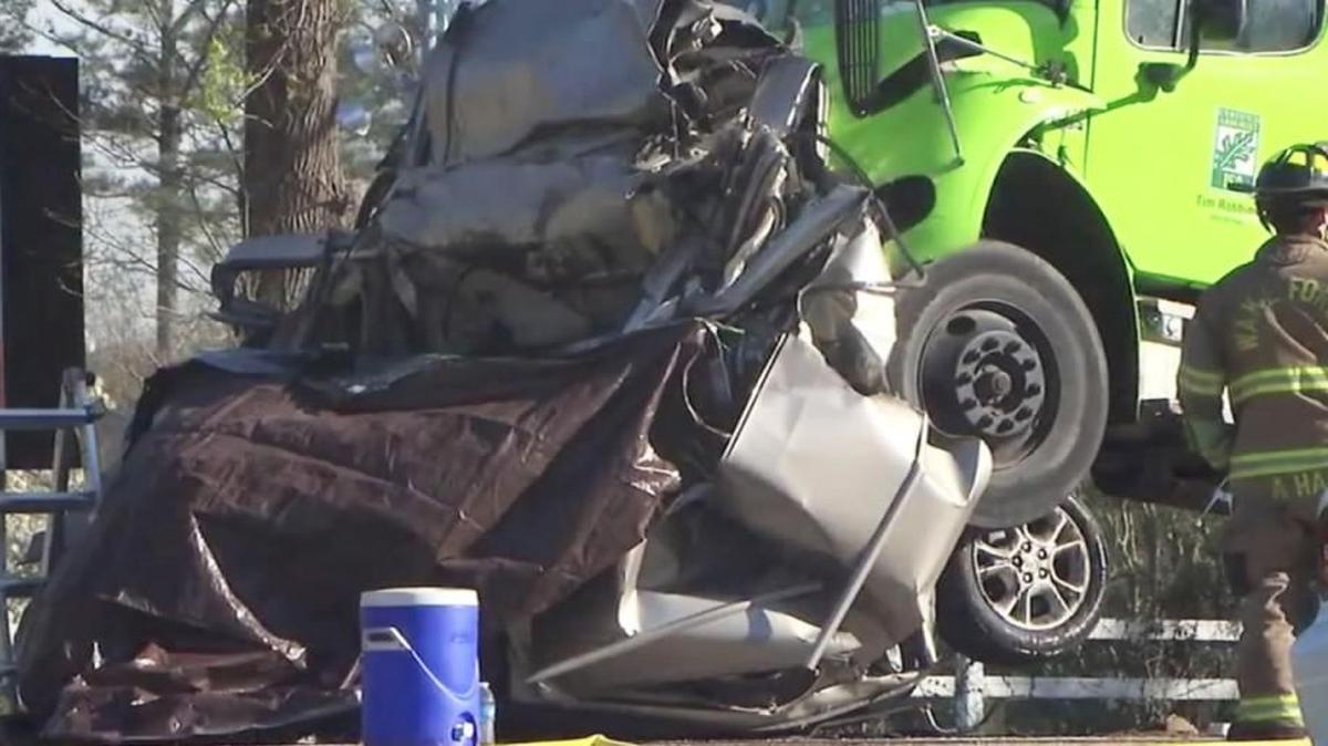 The wreckage of a minivan crushed between two trucks at the scene of an accident on Capital Boulevard near Burlington Mills Road on Tuesday, March 22, 2016 in Wake County. 42-year-old Michelle Simone Barlow of Wake Forest, who was driving the minivan, was killed.