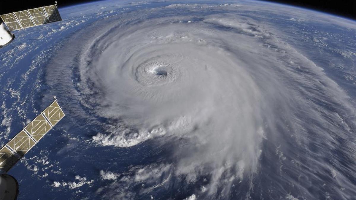 This image provided by NASA shows Hurricane Florence from the International Space Station on Wednesday, Sept. 12, 2018, as it threatens the U.S. East Coast. Hurricane Florence is coming closer and getting stronger on a path to squat over North and South Carolina for days, surging over the coast, dumping feet of water deep inland and causing floods from the sea to the Appalachian Mountains and back again.