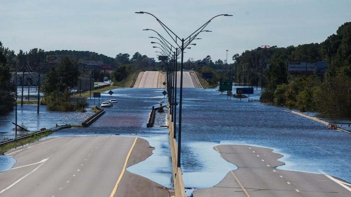 The Lumber River flows over Interstate 95 Monday, October 10, 2016 in Lumberton, NC. A state Highway Patrol sergeant shot and killed a man who drew a handgun while the sergeant and two Robeson County sheriff's deputies were taking part in a search and rescue effort in Lumberton Monday night.