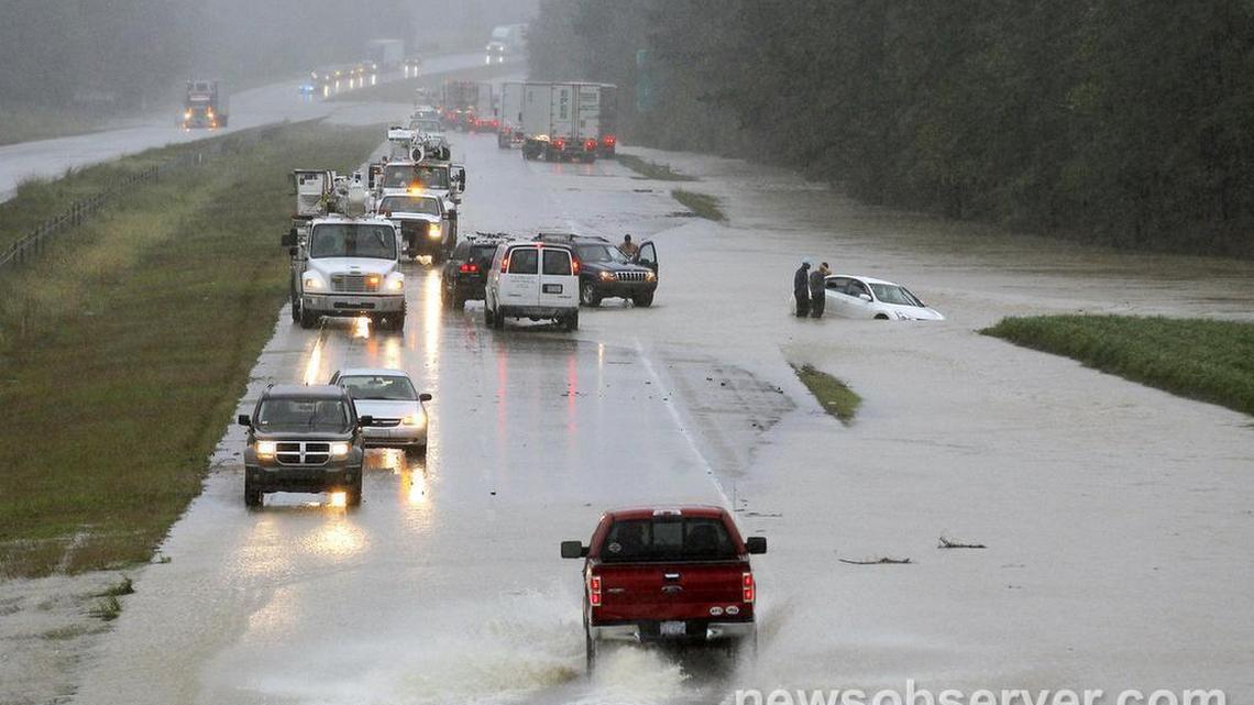 Motorists get stranded as I-40 eastbound floods over near the intersection with Highway 242 as Hurricane Matthew brings heavy rains to the area around and in Benson NC on Saturday, Oct. 8, 2016.