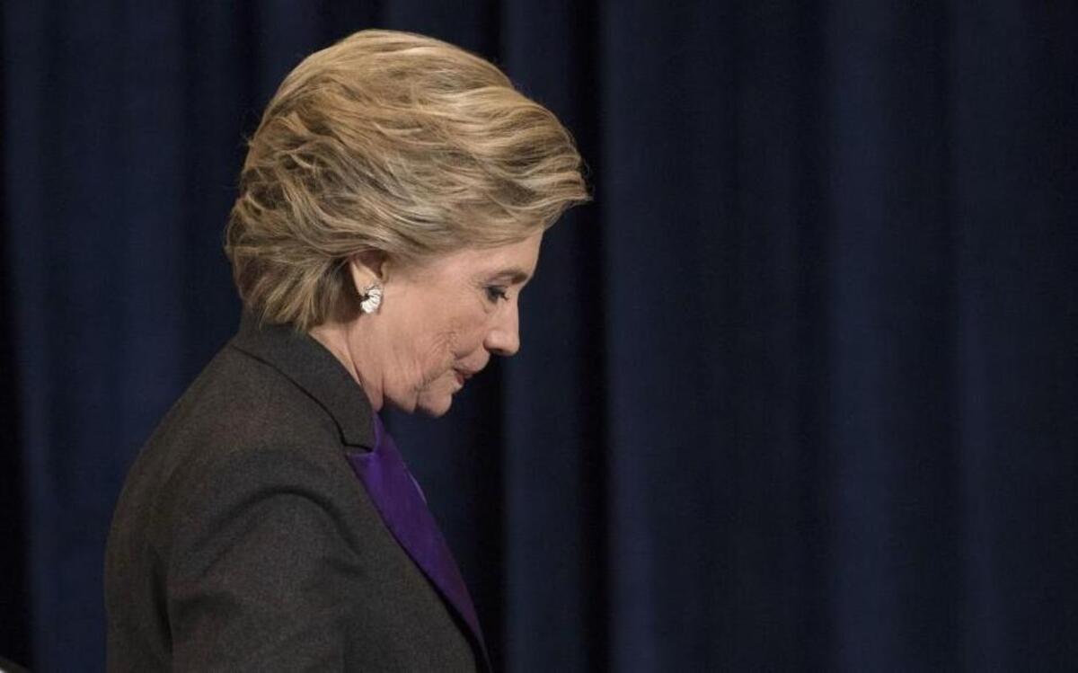 Democratic presidential candidate Hillary Clinton walks off the stage after speaking in New York, Wednesday, Nov. 9, 2016. Clinton conceded the presidency to Donald Trump in a phone call early Wednesday morning, a stunning end to a campaign that appeared poised right up until election day to make her the first woman elected U.S. president.