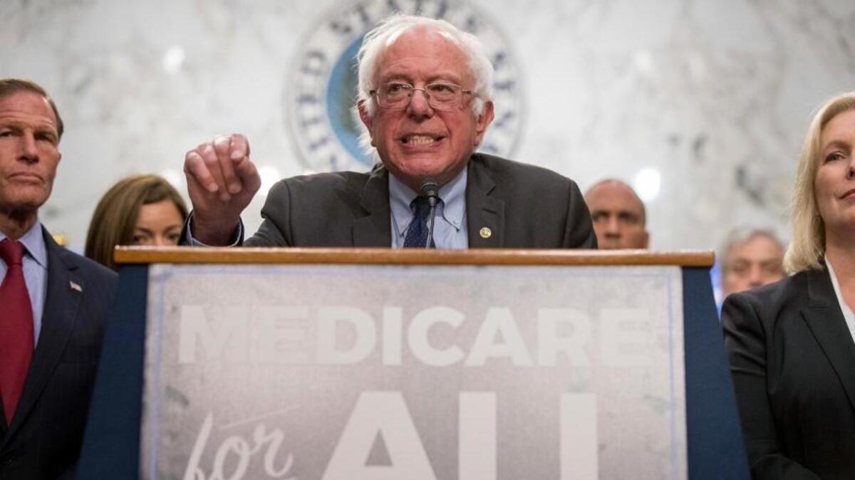 Sen. Bernie Sanders, I-Vt., center, accompanied by Sen. Richard Blumenthal, D-Conn., left, and Sen. Kirsten Gillibrand, D-N.Y., right, speaks at a news conference on Capitol Hill in Washington, Wednesday, Sept. 13, 2017, to unveil their Medicare for All legislation to reform health care.