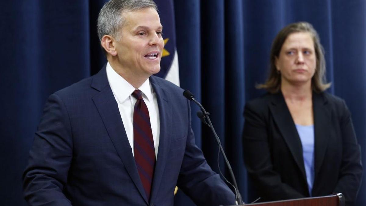 N.C. Attorney General Josh Stein, left, said he had to cut about 45 workers from his department due to budget cuts during a press conference held in his offices in Raleigh on Aug. 3, 2017. Wake County District Attorney Lorrin Freeman listens at right.